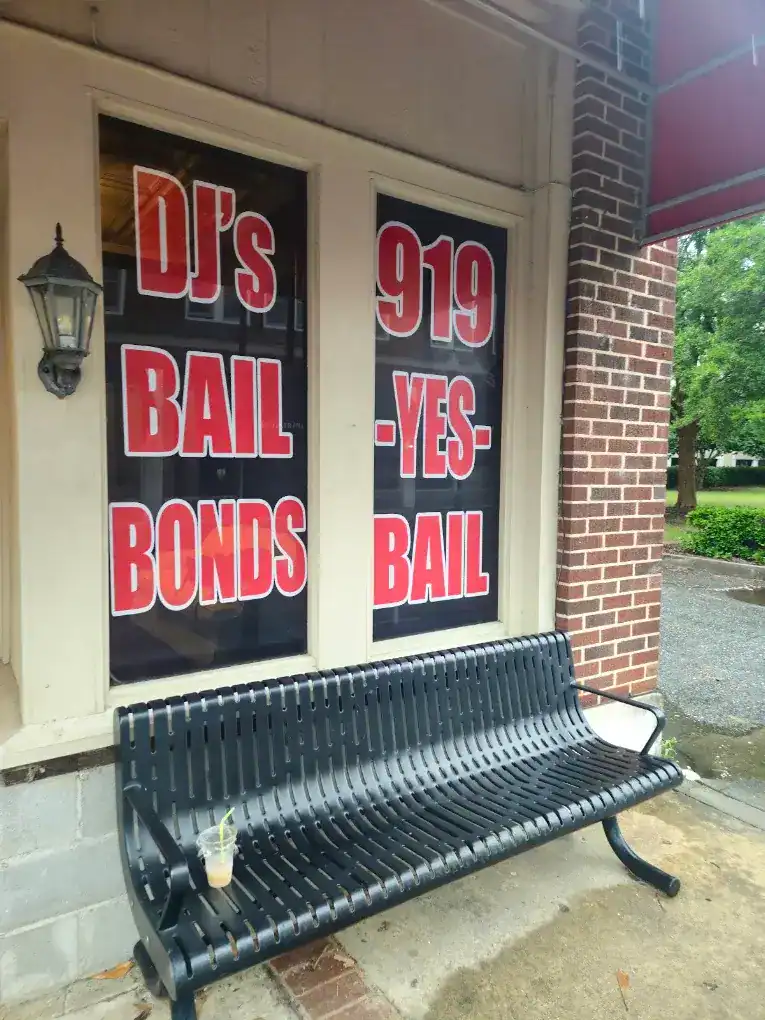 DJ's Bail Bonds Smithfield office window displaying 919-YES-BAIL