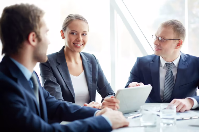 Bail bond professionals discussing paperwork during a client consultation